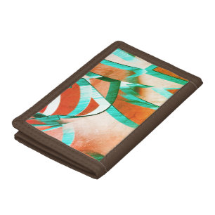 Blue or cyan streaks over rustic reddish orange tri-fold wallet