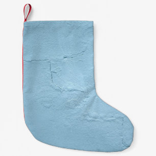Blue painted concrete wall during daytime small christmas stocking