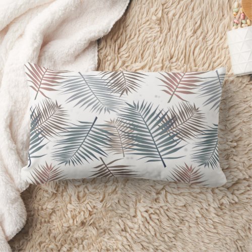 Blue palm leaves on white lumbar pillow