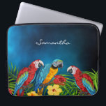 Blue parrots palm foliage monogram laptop sleeve<br><div class="desc">Tropical birds,  parrots in blue,  yellow and red sitting on green palm leaves.  Decorated with tropical flowers. A dark blue sky as background. The blue color is uneven. Template for a name,  white hand lettered style script.</div>