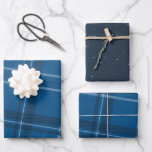 Blue plaid and stars classic wrapping paper sheets<br><div class="desc">A bold modern take on a classic plaid makes this wrapping paper set perfect way for both traditional and unconventional gift givers. The blue background with the tilted black and white checks is chic and stylish. Will look fantastic on all your gifts under the tree perfectly coordinated with your Christmas...</div>