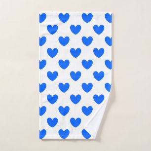 Blue polka hearts on white hand towel 