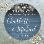 Blue Rustic String Lights Wedding Favor Thank You Classic Round Sticker<br><div class="desc">Rustic signature script wedding favor thank you classic round sticker featuring pretty string lights and signature style names on a blue wood panels background. Personalize with your special thank you information in chic white typography. Designed by Thisisnotme©</div>