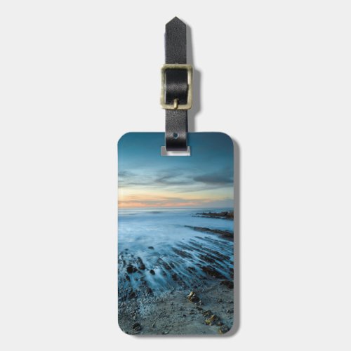 Blue seascape at sunset California Luggage Tag