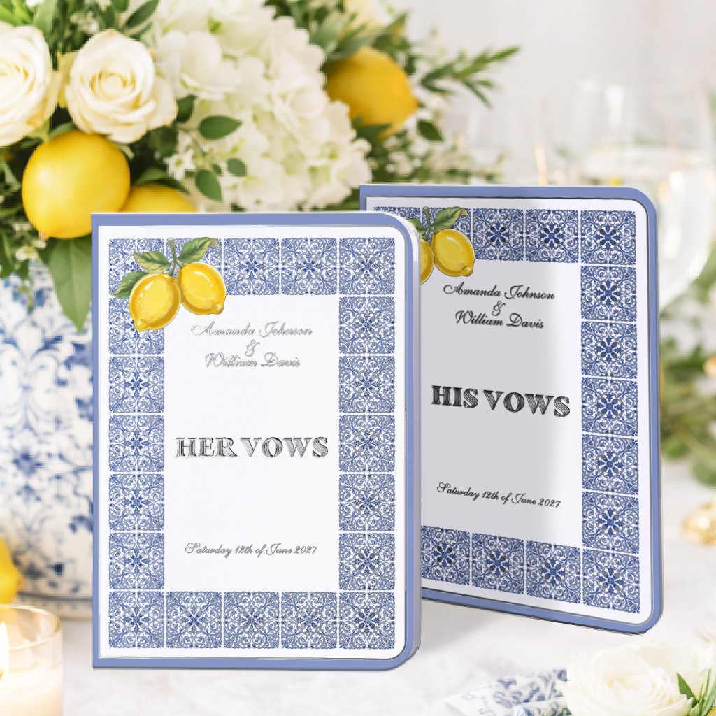 Set of His & Her wedding vow books inspired by the Amalfi Coast, featuring hand-painted lemons and intricate blue Mediterranean tile patterns on a crisp white background. Real silver foil typography reading “His Vows” and “Her Vows” adds a soft luminous touch, echoed in delicate borders and design accents. The overall look is light, elegant, and refined, with a romantic Italian coastal aesthetic. Personalizable names and wedding date make the set a meaningful and sophisticated keepsake.
