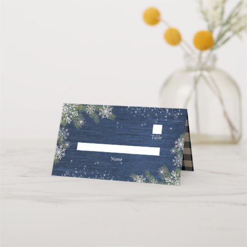 Blue Silver Winter Wood Plaid Rustic Place Card - Create the perfect reception setting for your rustic winter wonderland design using this warm, snowflake and pine place card. Designed to allow you to write the name of the guest in a white box, the card front features a navy blue wood background. The word 'name' has been designed as a template to indicate where to write the name of the guest in, but also so that you can deleted the placeholder text, if you like, so that it won't appear on the printed placecard. The back and interior of the card has been designed with a coordinating tan and navy buffalo plaid texture. Contact designer for matching products. View collection here: https://www.zazzle.com/collections/blue_silver_winter_wood_plaid_rustic_wedding-119104954383328676 Copyright Elegant Invites, all rights reserved.
