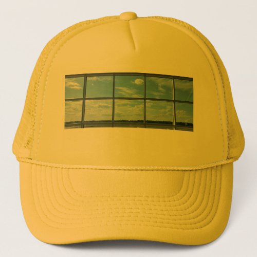 blue sky airport window trucker hat