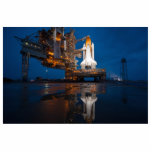 Blue Sky for Space Shuttle Atlantis Launch Cutout<br><div class="desc">Rain-washed twilight bathed the scene in a cool, ethereal light. The last traces of the storm lingered in the sky, vast and a deep, calming blue. Puddles on the launchpad reflected the soft glow of the Space Shuttle, its belly lit with an intricate dance of white lights. A hushed anticipation...</div>
