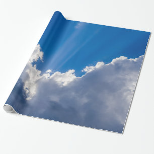 Blue sky with white clouds and ray of sunshine. wrapping paper