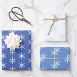 Blue Snowflake Wrapping Paper Sheets<br><div class="desc">Three styles of icy blue snowflakes on different shades of blue or white for a three part wrapping paper set you can use for any winter holiday.</div>