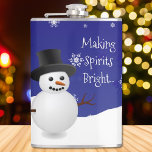 Blue Snowman Winter Scene Christmas Flask<br><div class="desc">Enjoy your favorite adult beverage with this festive Blue Snowman Winter Scene Christmas Flask. Flask design features a happy snowman in a snowy wintry scene against a royal blue background adorned with matching color snowflakes and the saying "Making Spirits Bright" which you can leave or personalize with your own saying....</div>