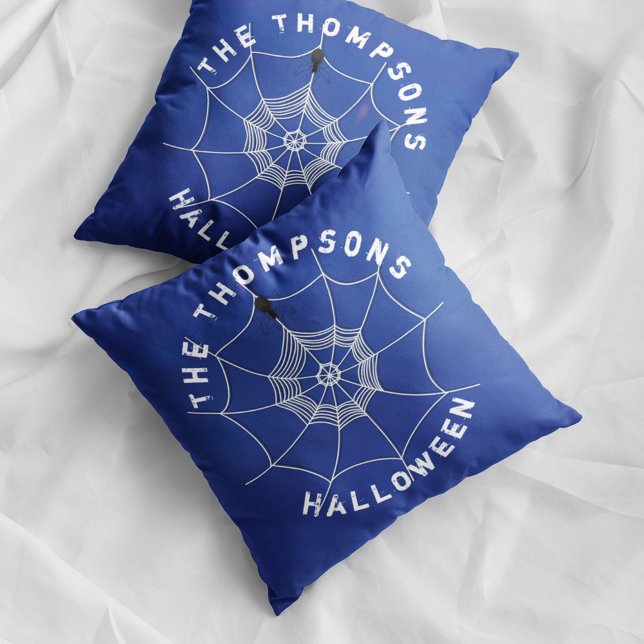 Blue Spider Web Personalized Family Halloween Throw Pillow (Blue Halloween spider web pillow with personalized family name and spooky spider decor.)
