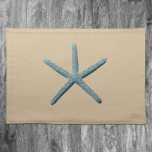 Blue Starfish On Beige Sand Background