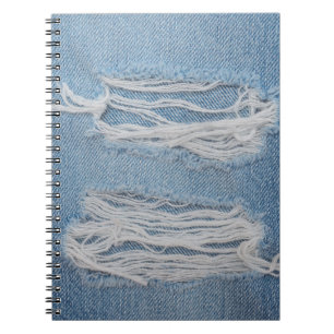 Blue torn denim jeans texture background. Stylish, Notebook
