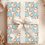 Blue Vintage Santa Claus Face Watercolor Wrapping Paper<br><div class="desc">Wrap your gifts in festive cheer with our Blue Vintage Santa Claus Face Watercolor Wrapping Paper! This charming design features nostalgic watercolor illustrations of Santa Claus faces set against a vibrant background, adorned with delicate snowflakes. Perfect for adding a touch of vintage charm to your holiday presents, this wrapping paper...</div>