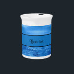 Blue Waters Drink Pitcher<br><div class="desc">A fun cool, summery blue water effect printed images. The top half of this design has a smooth pale blue watery effect, and the lower half has a more darker and rougher water look effect. In the center is a blue strip of which you can customize. A great design for...</div>