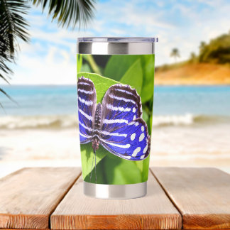 Blue Wave Butterfly Resting on Green Leaves Insulated Tumbler