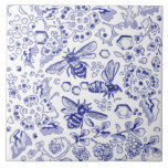 Blue White Bee Honey Floral Farmhouse Rustic Art Ceramic Tile<br><div class="desc">Three bees in soft blue hues on white form a stylized design with a farmhouse, country or even rustic theme. There are wild flower floral and leaf designs inspired by antique delft and oriental chinoiserie pottery motifs and colors. I've added a few hexagonal honeycomb shapes as well. This tile is...</div>