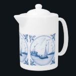 Blue White Delft Sailboat Teapot<br><div class="desc">Pretty vintage blue and white Delft art of a sailboat sailing on the water in the harbor, surrounded by floral elements. This art is reproduced from an antique handpainted tile. Click Customize It to add your name or message, change background colors, even save your design for later.</div>