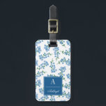 Blue White Forget Me Not Pattern Luggage Tag<br><div class="desc">Cute floral luggage tag with a pattern of forget-me-nots in blue,  white,  and green. Add your name and initial on a blue label. The back features a flower twig on a dark blue background and you can personalize with your name and address.</div>