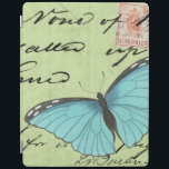 Blue-Winged Butterfly on Teal Postcard<br><div class="desc">This teal postcard carries a message of beauty. A delicate blue-winged butterfly rests on the card,  obscuring some of the script it contains. This Vision Studio print would make a great addition to your home!</div>
