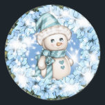 Blue Winter Snowman Sticker<br><div class="desc">Cute little snowman wearing light baby blue winter hat and scarf and a sparkly blue green Christmas flower frame. Great Christmas idea for a lover of all things blue.</div>
