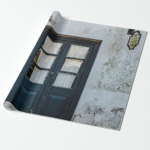 BLUE WOODEN DOOR PANEL IN WHITE BUILDING WRAPPING PAPER
