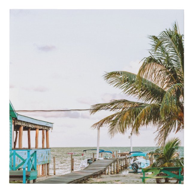 BLUE WOODEN HOUSE NEAR BODY OF WATER FAUX CANVAS PRINT (Front)