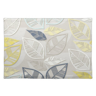 blue yellow white leaves in rows on gray cloth placemat