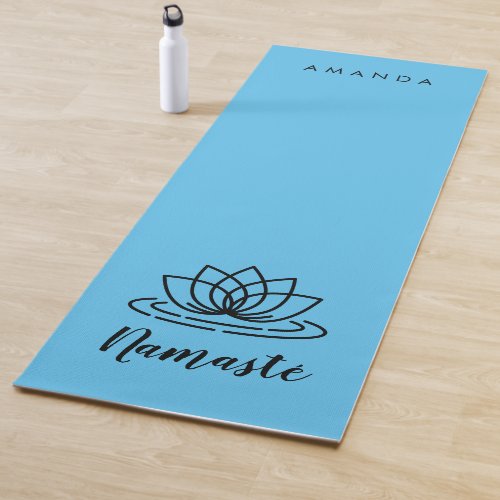 Blue yoga mat with lotus for teacher or instructor