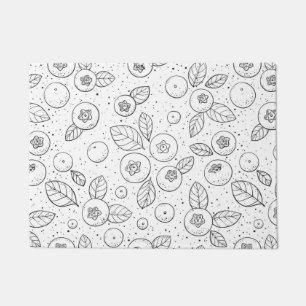Blueberries on black and white doormat
