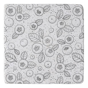 Blueberries on black and white trivet