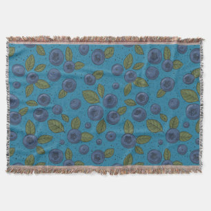 Blueberries on blue throw blanket