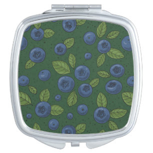 Blueberries on dark green compact mirror