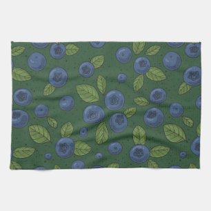 Blueberries on dark green kitchen towel