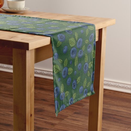 Blueberries on dark green short table runner