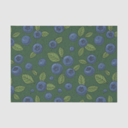 Blueberries on dark green tissue paper