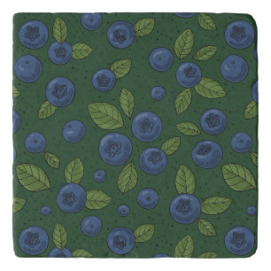 Blueberries on dark green trivet