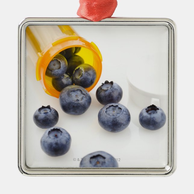 Blueberries spilling from prescription bottle metal ornament (Front)