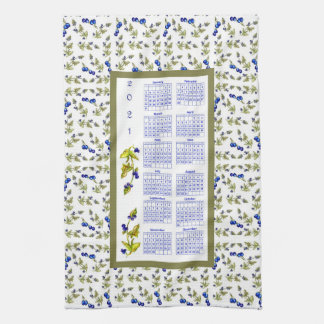 Blueberries with stemmed leaves border kitchen towel