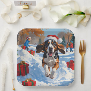 Bluetick Coonhound Running in Snow with Christmas  Paper Plates