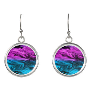Blurred background fashionable crimson and blue earrings