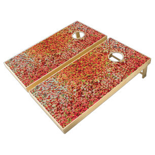 Blurred coral and pink in small squares or tiles cornhole set