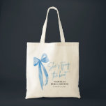 Blush Blue Bow She's Tying the Knot Bridal Shower  Tote Bag<br><div class="desc">Introducing the Blush Blue Bow She's Tying the Knot" Bridal Shower Tote Bag – the perfect keepsake for celebrating the bride-to-be! This elegant tote bag features a blush background with a beautiful blue bow design, adding a touch of sophistication to any bridal shower. Made from durable, eco-friendly fabric, this spacious...</div>