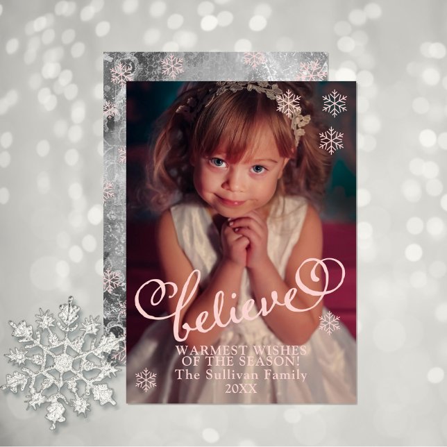 Blush Pink Believe  | Snowflakes Christmas Photo Holiday Card (Warmest Wishes of the Season with this pink script text and snowflake "Believe" holiday photo card.)