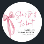 Blush Pink Bow She's Tying the Knot Bridal Shower Classic Round Sticker<br><div class="desc">Add a touch of elegance to your bridal shower favors with these charming blush pink bow 'She's Tying the Knot' stickers. Perfect for adorning gift bags,  boxes,  or jars,  these stickers add a lovely finishing touch to your celebration."</div>