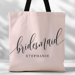 Blush Pink Bridesmaid Modern Script Tote Bag<br><div class="desc">Show your appreciation to your bridal party with this stylish blush pink bridesmaid tote bag. Featuring modern script and customizable with your bridesmaid's name, this tote bag is both practical and elegant. The soft color and chic design make it perfect for carrying wedding day essentials or everyday items. This personalized...</div>