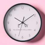 Blush Pink Modern Minimalist Monogram Name Clock<br><div class="desc">Enhance your home decor with our Classic Elegant Modern Minimalist Monogram Wall Clock. This exquisite timepiece seamlessly combines timeless elegance with contemporary minimalism, elevating your living space to new levels of sophistication. Crafted with precision and meticulous attention to detail, this wall clock is more than just a functional accessory; it's...</div>