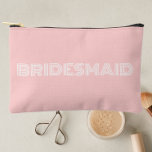 Blush Pink Modern Typography Bridesmaid Accessory Pouch<br><div class="desc">Solid blush pink color,  small style,  zippered cosmetic bag for your wedding bridesmaid that features the word,  BRIDESMAID in large,  modern typography on one side of bag. Perfect as a travel accessory pouch to hold makeup,  perfume,  and jewelry. You may personalize by adding bridesmaid name if desired to pouch.</div>