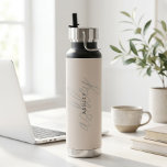 Blush Pink Name Minimalist Modern  Water Bottle<br><div class="desc">Give your hydration a personal touch with our Personalized Custom Blush Pink Water Bottle! With a sleek,  modern design and your name in elegant script,  make every sip a statement. It's not just a water bottle,  it's a fashion-forward accessory that boosts your style and well-being. Stay refreshed uniquely!</div>